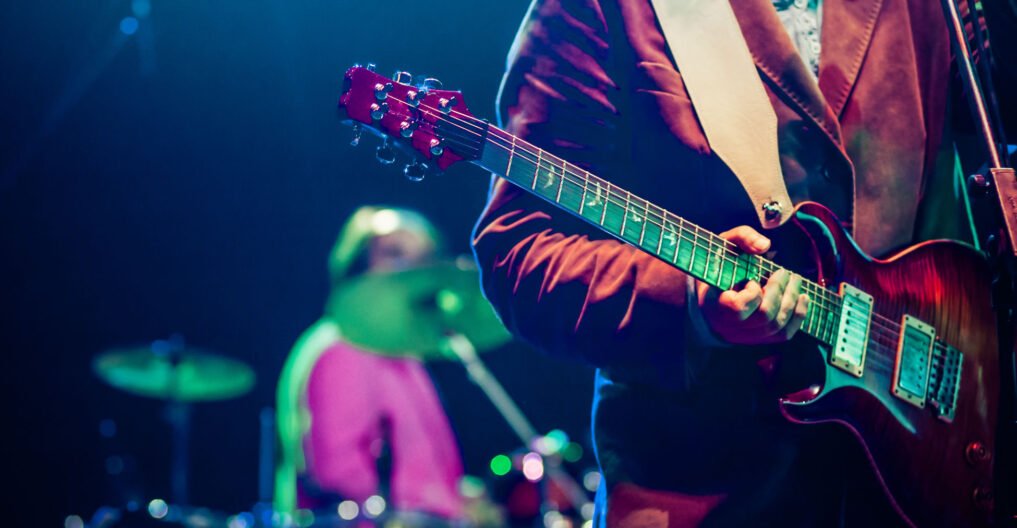 guitarist on stage - summer music festival guitarist on stage - summer music festival